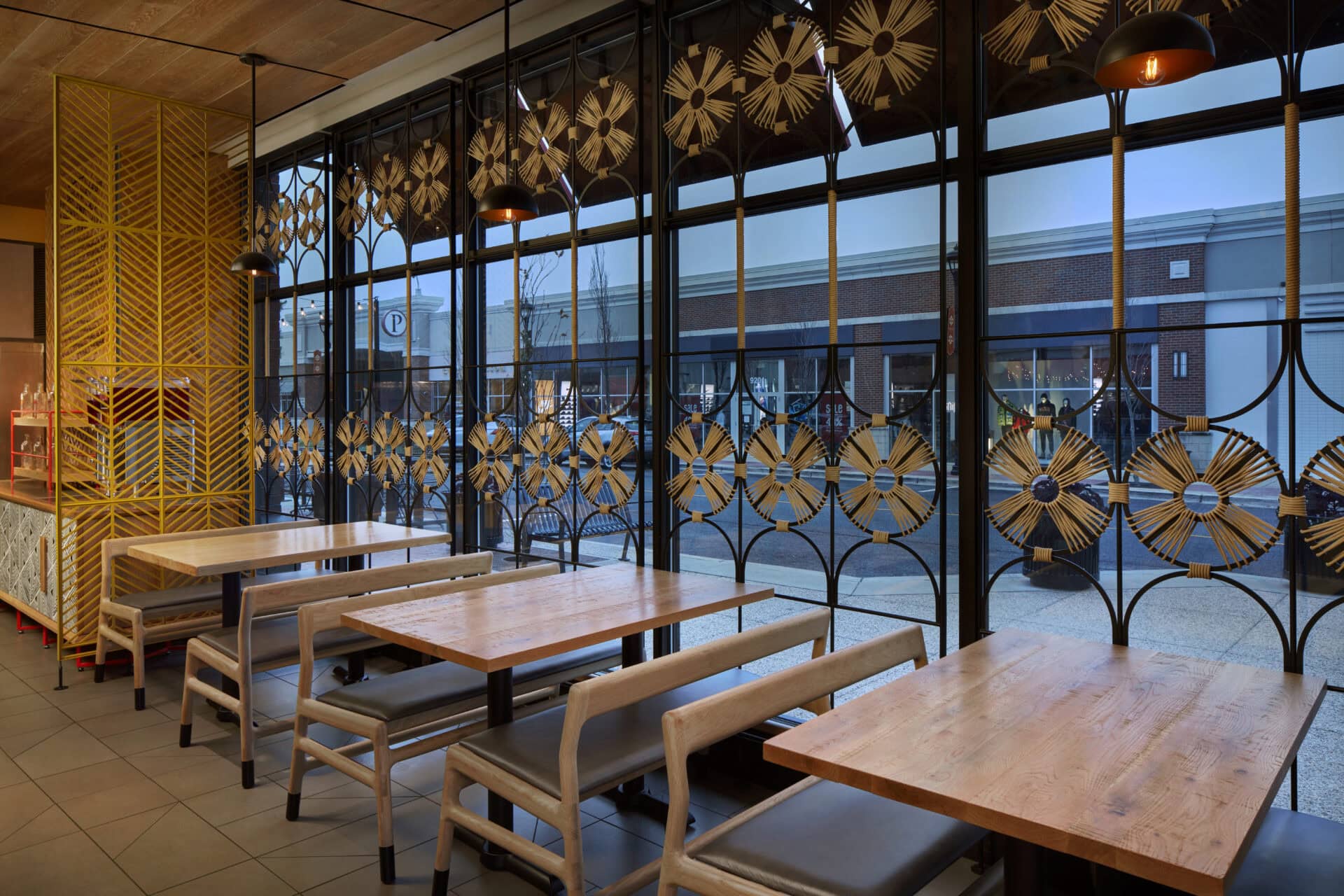 Steel and woven window-mounted screen with woven details by TheUrbanative in Nando’s Woodmore. 
